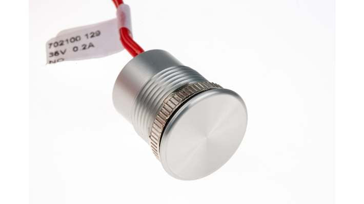 Interruttore piezoelettrico Saia-Burgess TH702100129, colore argento, IP68, pre-cablato, diametro foratura 18 mm.