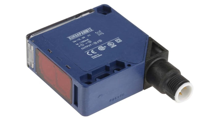 Sensore fotoelettrico compatto Telemecanique Sensors XUK9APANM12, rilevamento 5m, uscita PNP, design 50x50mm, IP65, ideale per applicazioni industriali.