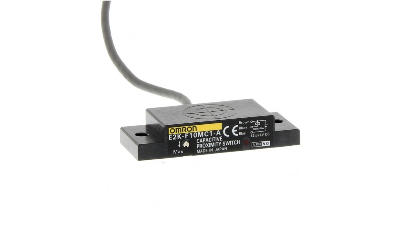 Sensore capacitivo Omron E2K-F10MC1-A 2M, corpo piatto, uscita NPN, rilevamento a 10 mm, alimentazione 12-24 V, IP64.