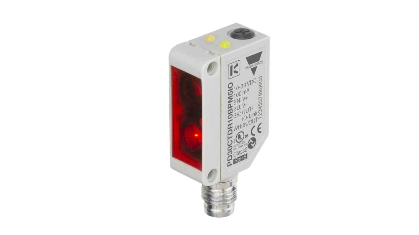 Carlo Gavazzi PD30CTDR10BPM5IO, sensore fotoelettrico compatto con rilevamento fino a 1000 mm, uscita NPN/PNP, dimensioni 10 x 20 x 30 mm.