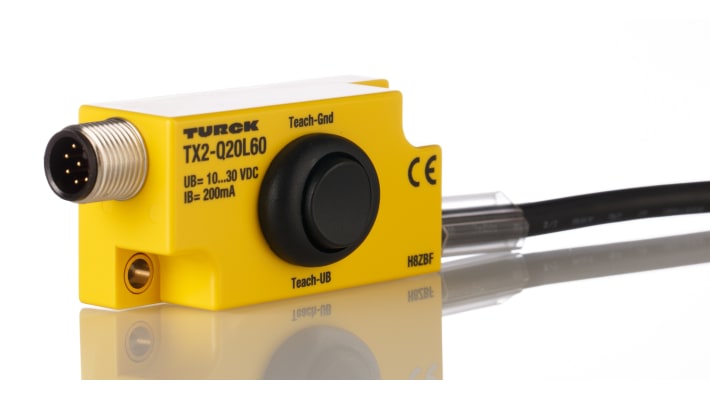 Modulo di programmazione Turck TX2-Q20L60 per encoder induttivi, con DIP switch per intervalli di misurazione personalizzabili.